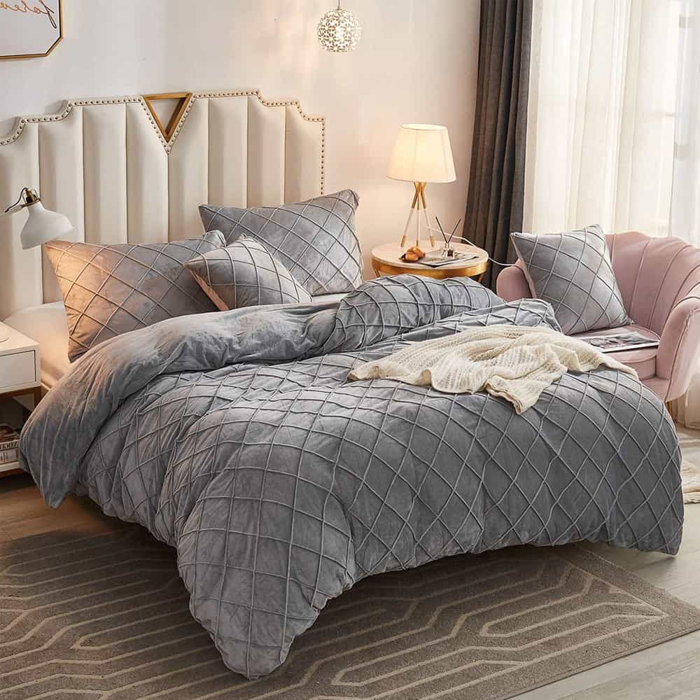Luxury velvet cross-pleated duvet set in deep [color], including duvet cover, bedsheet, pillow covers, and cushion covers, arranged neatly on a bed for an elegant bedroom setup.